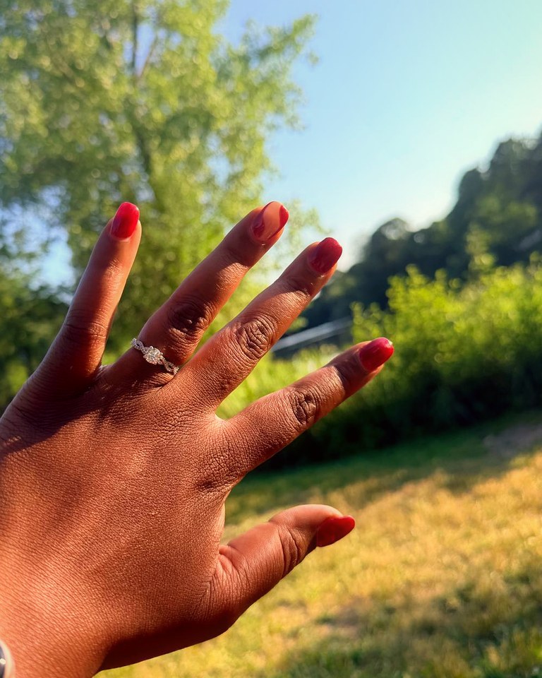 Gamu's hand showing her engagement ring in the sunshine